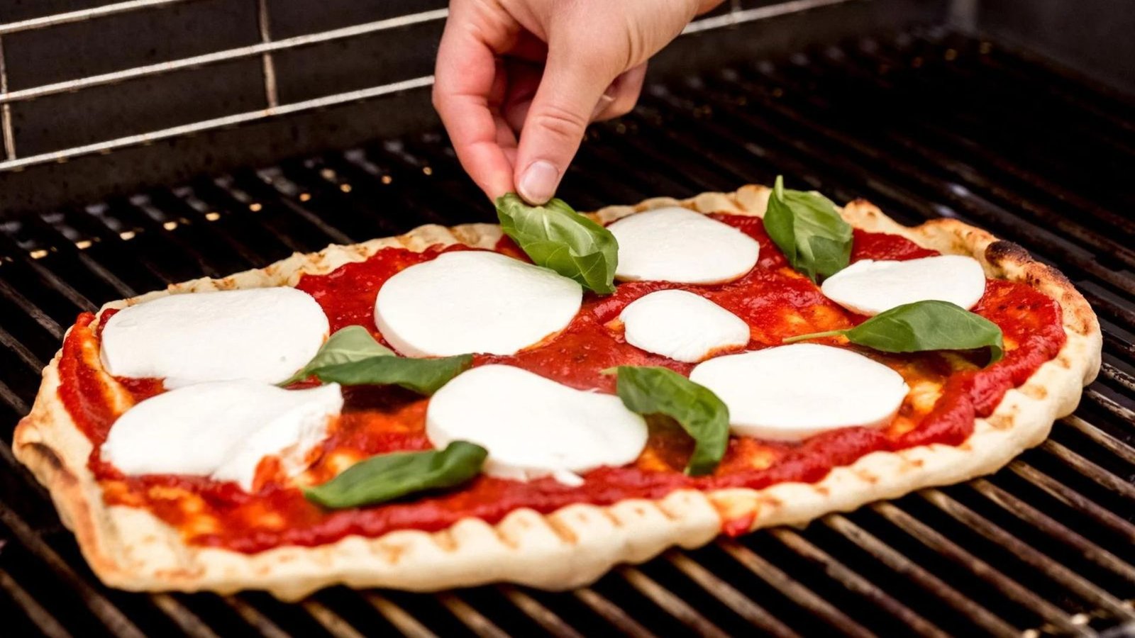 A man Grilling the Perfect Pizza