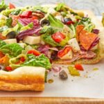 pizza paired with fresh salads